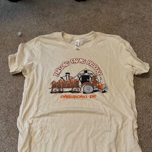 Cream Graphic T-Shirt with Orange and Black Design